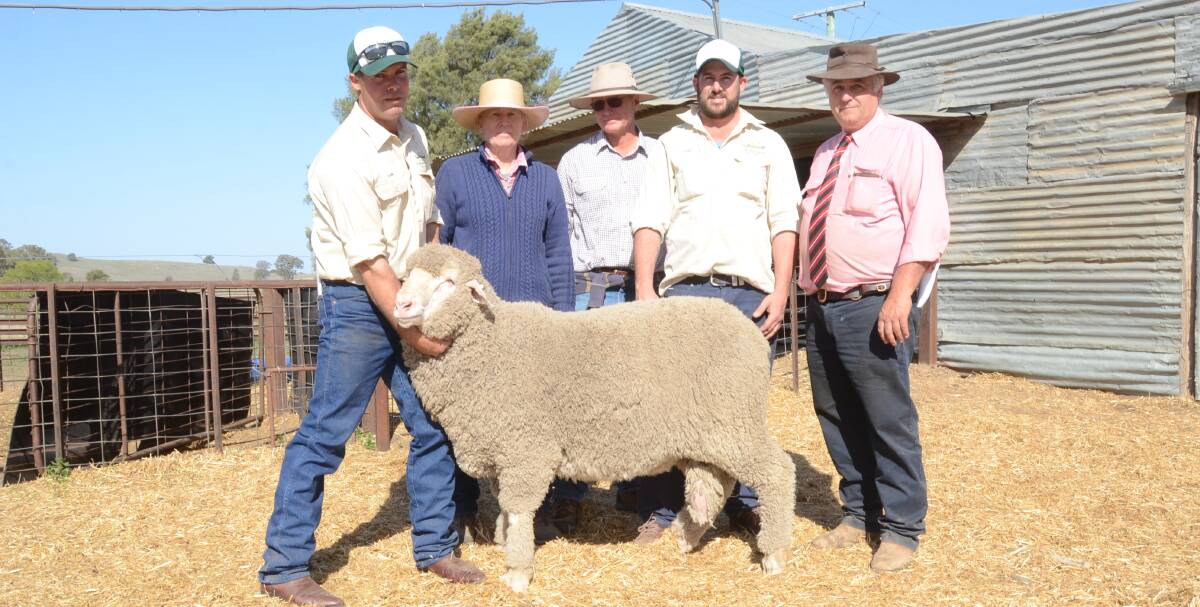GullenGamble stud manager  Dan Veer holds the $6500 equal top-priced ram for  buyers Erica and Dave Shorter, Boola, Burren Junction, Zac Hartin and Scott Thrift, Elders, Dubbo.