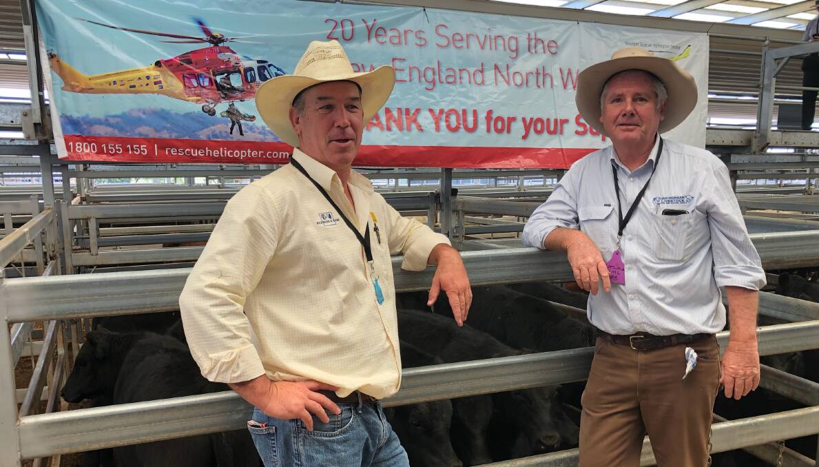 Tim Walsh, Fleming and Ross, Gunnedah, with Ian Morgan, Ian Morgan Livestock. Mr Walsh paid $1470 for the Haling steer donated to WRHS. Photo by Michelle Mahwinney.