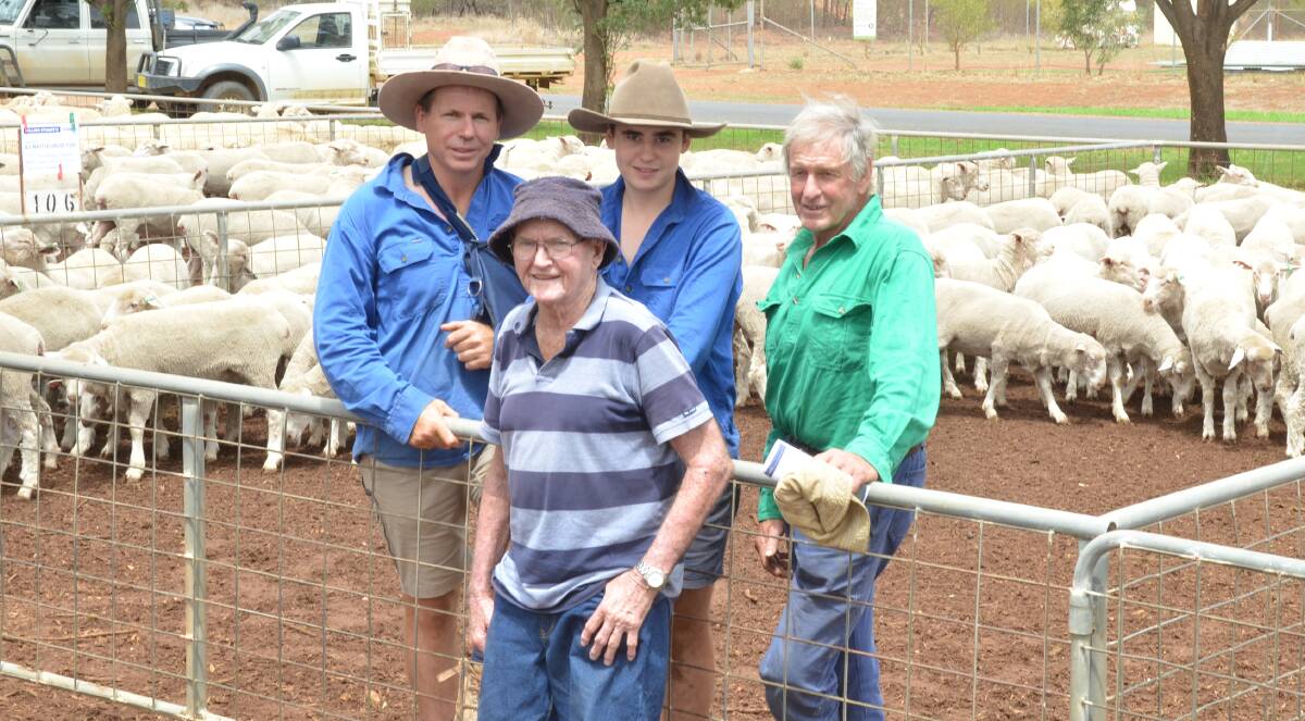The Inder family of Wattle Grove Partnership, Dunedoo, Mick, Joe and Ned among their $281 top-priced first-cross ewe pen bought by Warren Osborne, Oberon. With them is Geoff Armstrong, Braeleny, Oberon, a returning buyer who paid second top first-cross ewe money of $250 for the Wattle Grove second draft.