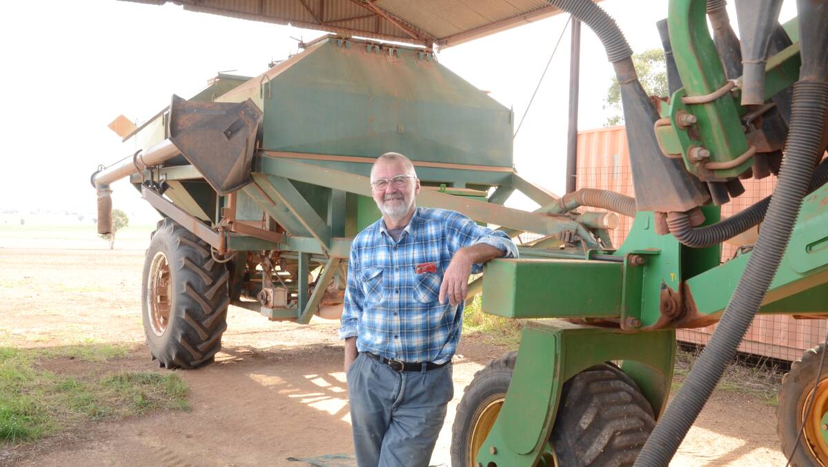 Peter Knowles with his home-made air seeder which has done 20 crop planting seasons since built in 2000. It works behind at Daybreak disc seeder of 8m width.