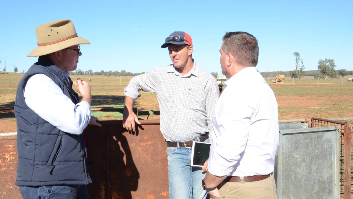 Minister for Agriculture and Western NSW, Adam Marshall, chats with Dubbo farmer Peter Ryan and local state member Dugald Saunders on Tuesday.