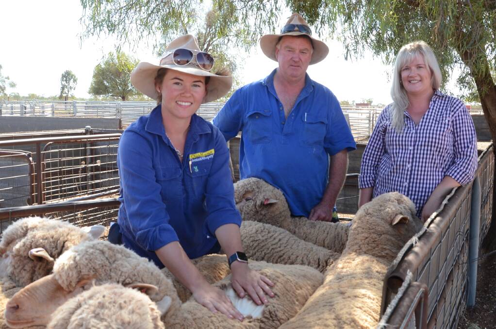 Emma Northey with her father, Paul and sister, Sally among Emma’s maiden ewes of Belswyk blood on Innisfail, Kikoira, 20 kilometres from Weethallie.