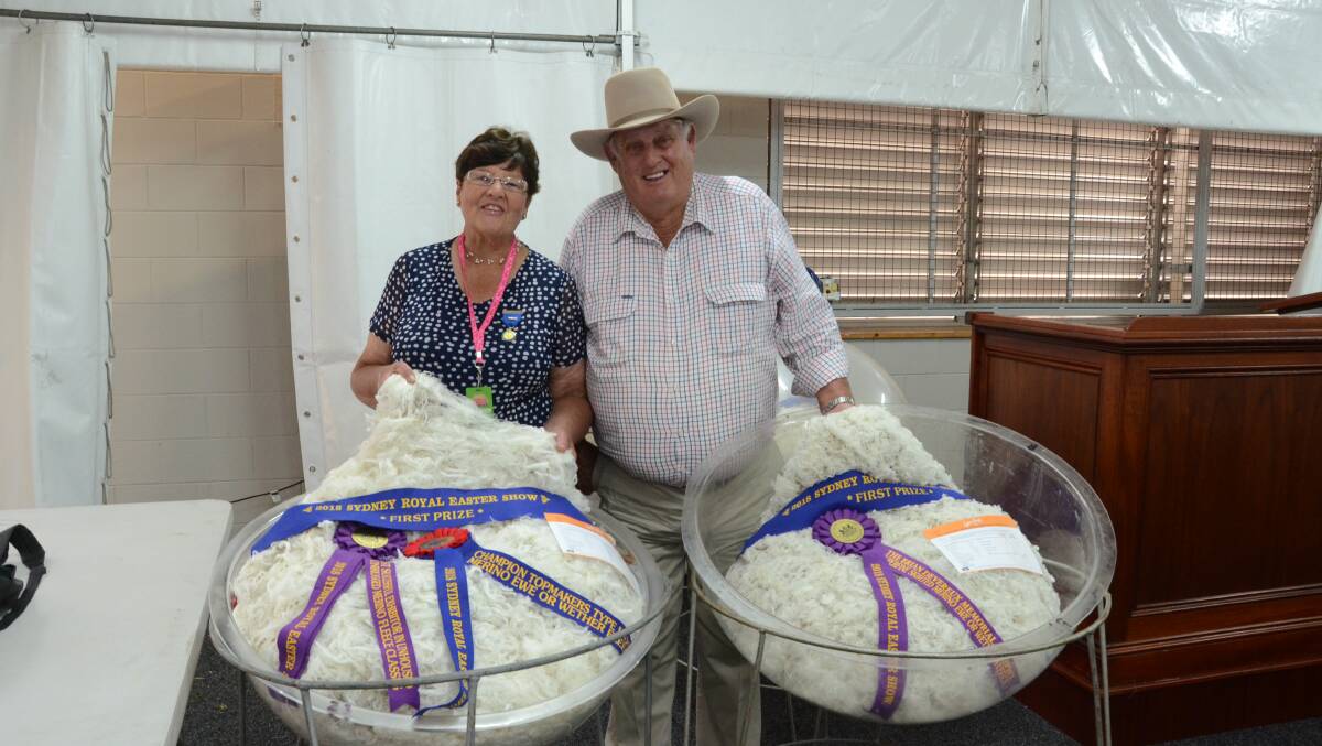 Lorraine and Ian Hills, Leawarra, Guyra, with two of their winning topmakers fleeces at Sydney Royal Show.