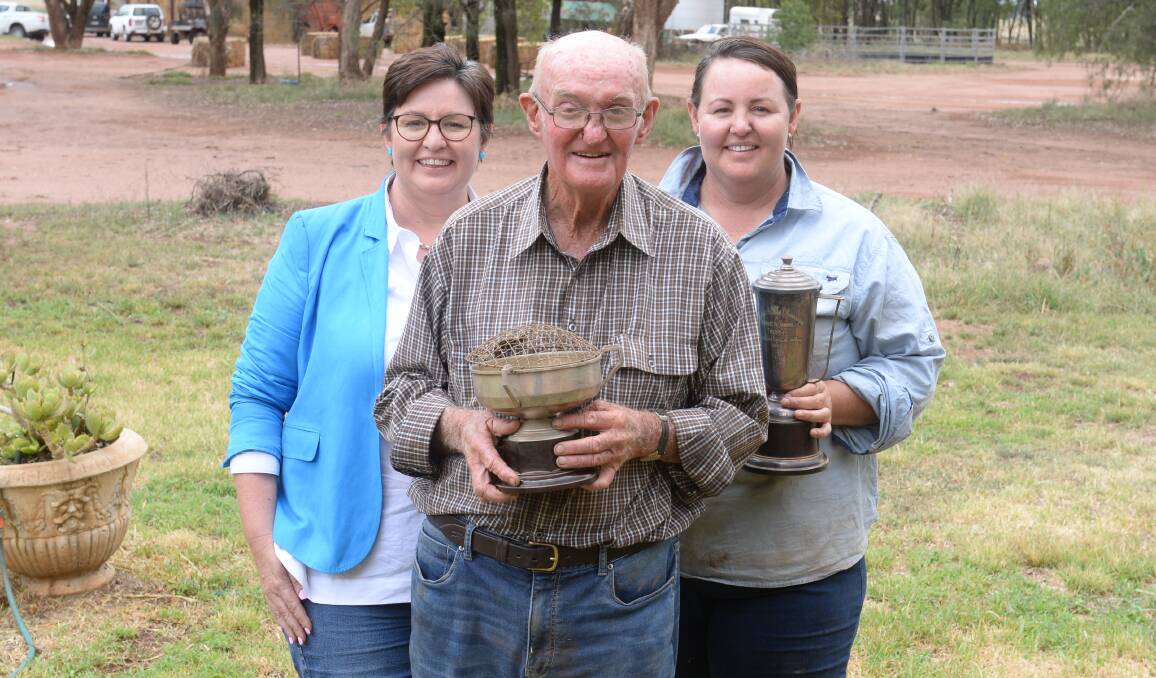 Trotting in the blood. Ian Williamson shows off trophies with daughters Fiona Aveyard and Felicity Williamson at Aurora Park, Peak Hill.