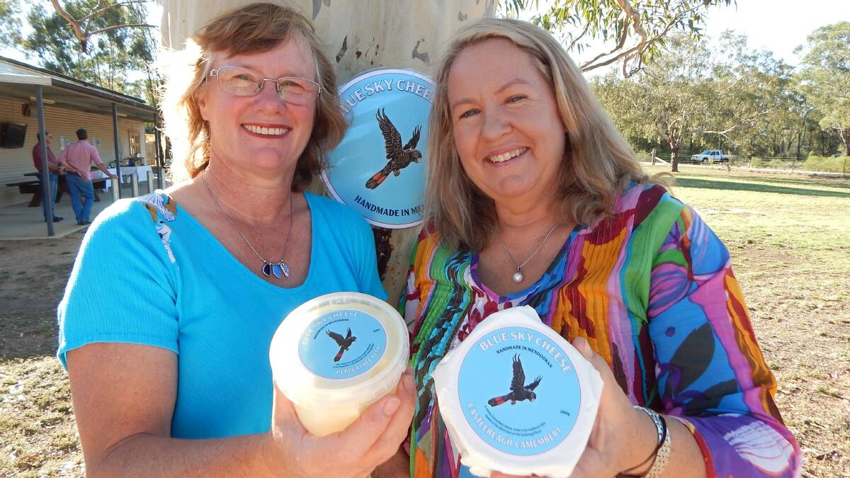 Cheese makers Deb Kiem and Pip Archer display their two Blue Sky Cheeses, Peppertree Feta and Castlereagh Camembert.