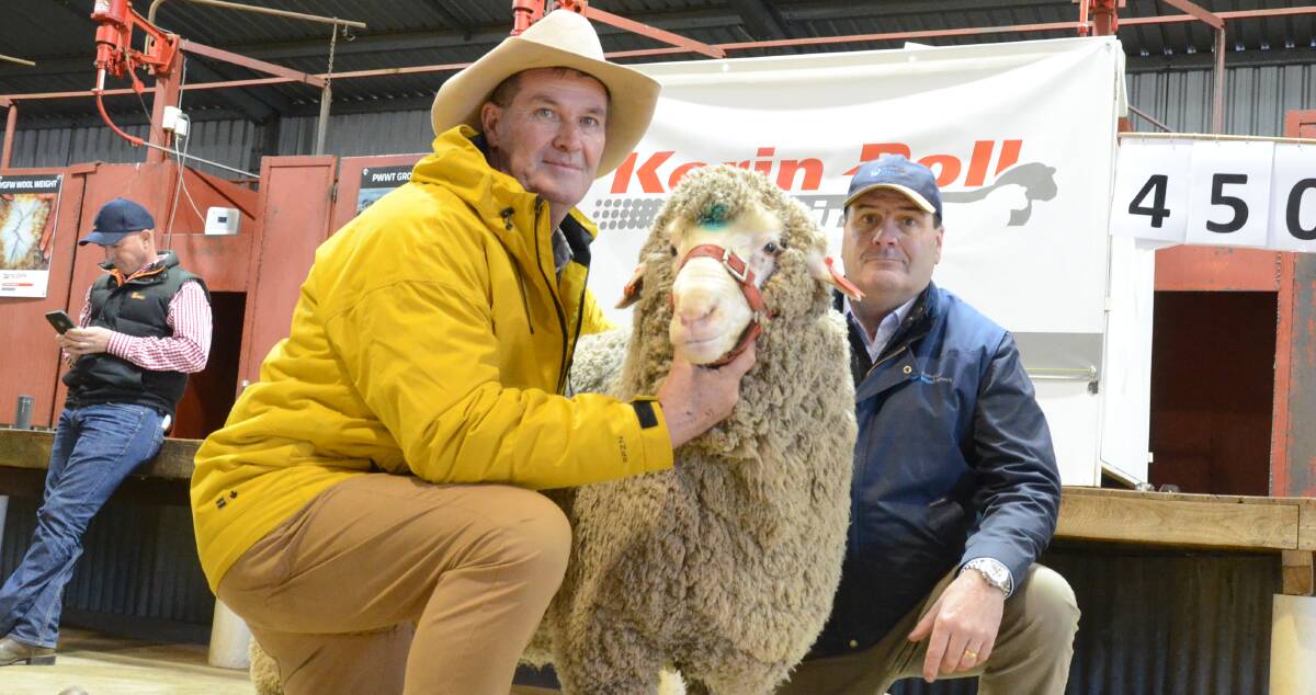 Kerin Poll co-principal, Nigel Kerin, holds the $10,000 top-priced ram with Brett Cox, AWN, Launceston, Tas, who purchased the ram for George Gatenby, Bicton Pty Ltd, Campbell Town, Tas.