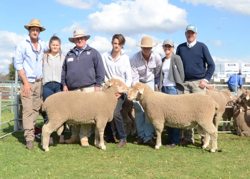 Two top-priced rams ($8000 and $7000) go to Western Australia. Macquarie stud's John and Grace Nadin, selling agent Chris Clemson Clemson Hiscox, Walgett, William, Peter and Robyn Nadin and auctioneer Paul Dooley.