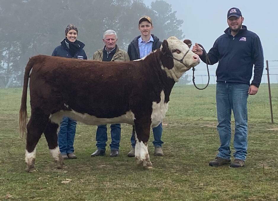 Jemma Reid of JTR Cattle Company, Roslyn, with her $10,5000 top-priced heifer, JTR Cherry Ripe Q006 with buyer, Caleb Croker (right) and his grandfather, Peter (centre).