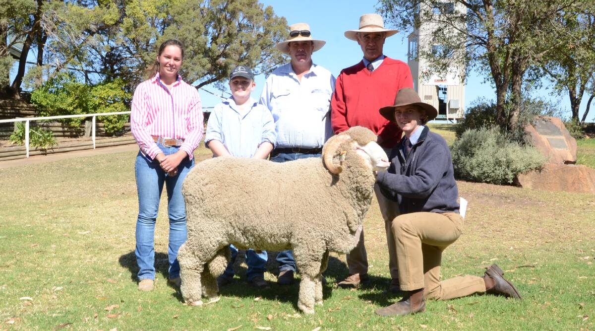 The McGrath family, Womboin Station, The Marra, paid second top money of $9000. Pictured are buyers Kate Denholm with Jack and Andrew McGrath with Egelabra general manager Cam Munro with Will Alexander holding the ram.