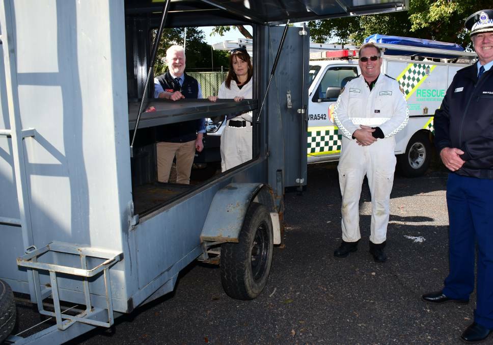 DONATED: Det. Insp. Cameron Whiteside of the Rural Crime Prevention Team, Mudgee, Dubbo Rescue Squad captain Natalie O'Brien and president Neil Sturrock with the trailer presented on Monday. PHOTO: BELINDA SOOLE. 