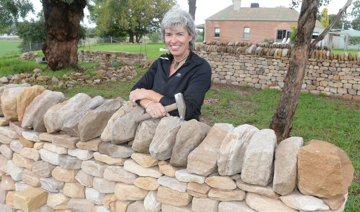 Wellington-based dry stone waller, Emma Knowles at one of her "Stone of Arc" walls at her Glenrock training Centre.