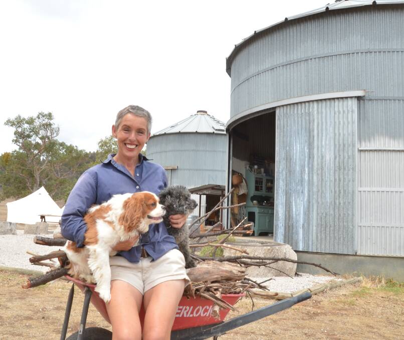 At the Melrose Park accommodation silos, Elizabeth Brennan with Alfie and Timothy, out the front near the open fire pit.