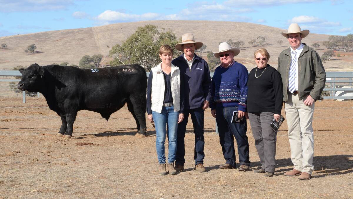 Equal $10,000 top-priced bull Heart Mojo with vendors Natalie and Chris Paterson, Heart stud, Tamworth, and buyers Neil and Colleen Stackman, "Bungara", Niangala, with guest auctioneer Paul Dooley, Tamworth.