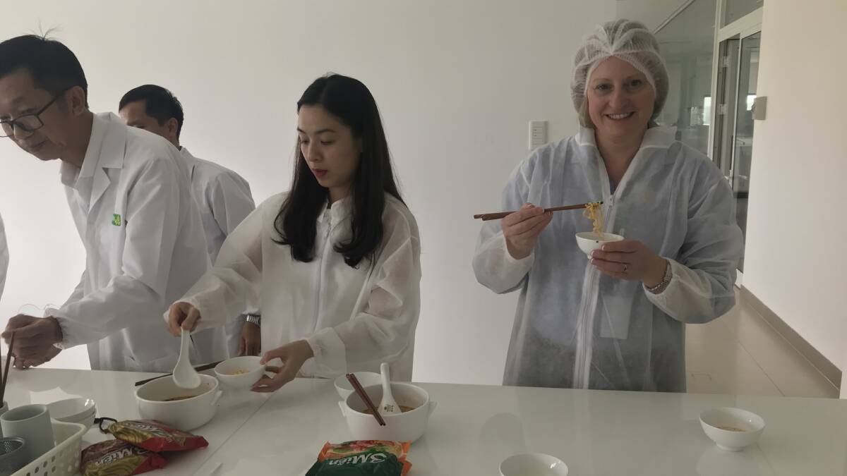 Julia Hausler samples noodles. She toured Indonesia, Thailand, the Philippines and Vietnam speaking on how wheat growers deliver clean and hygienic grain. 