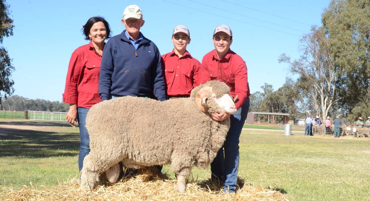Margot Rubie and sons Campbell and Mitchell, with the Sid Dickins, Audreylea, Booligal, and his $7000 top-priced Merino ram.