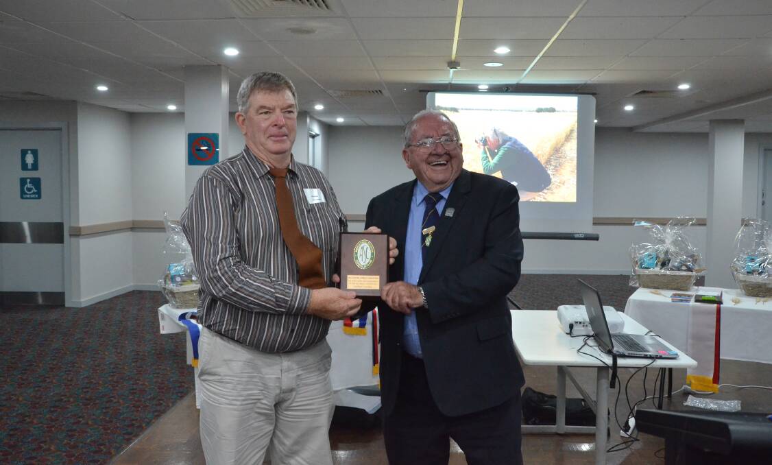 Graham Lieschke, Henty, is presented with a dedication and commitment to the competition award for his services to the southern region by competition coordinator Tom Dwyer.