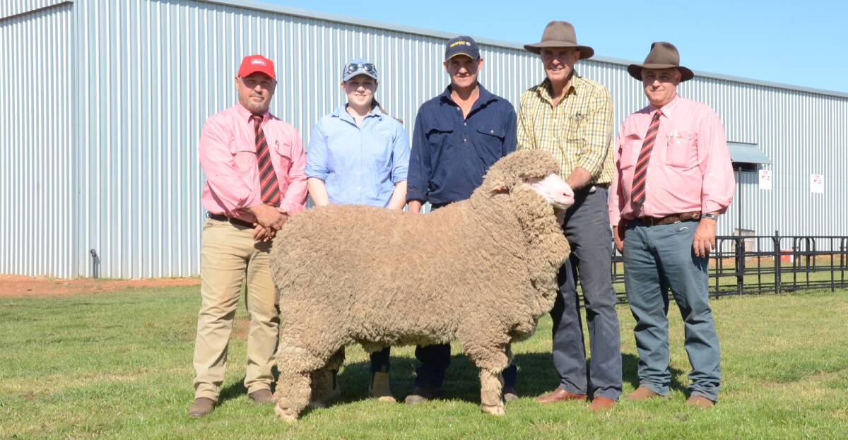 The Kelly family, Kelvri, Crookwell, purchased the $4500 sale-topper, the medium wool August shorn champion at Dubbo National, Reserve at Sydney Royal show and champion at the recent Condobolin show. Pictured is Craig Pearsall, Elders, Goulburn; buyers Lauren and Mick Kelly, vendor Garry Kopp and Scott Thrift, Elders, Dubbo.