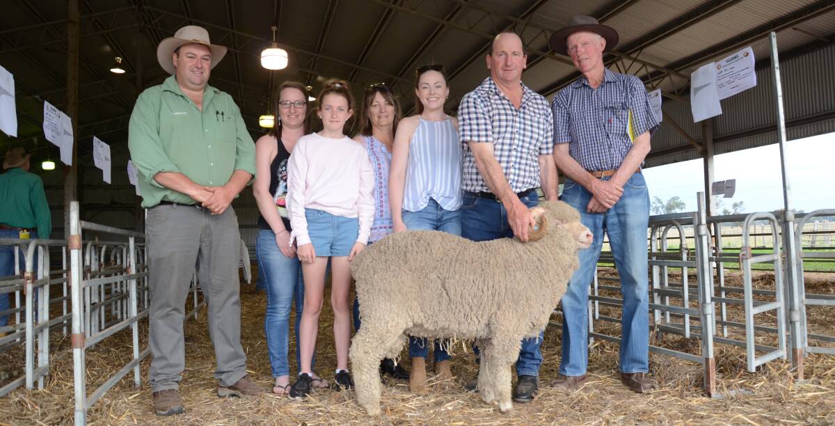 Auctioneer, Landmark's Brad Wilson, Dubbo, with buyers, the O'Reilly family, Wyoming, Gulgong, and Glanna stud's Ron Rayner, with the sale's top-priced $3600 ram.
