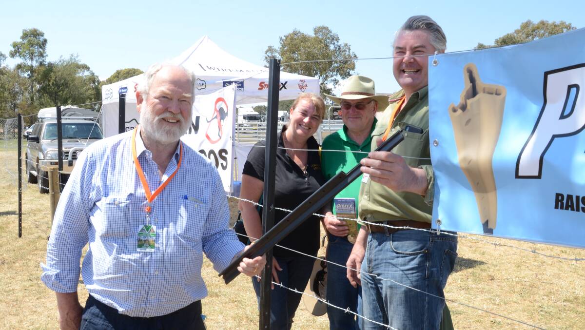 Fraser Old (left) and Ian Lowrey (right) show the PickeX plastic extension made of recycled PVC that will instantly raise the height of a picket fence to visitors Debbie and Graham Higham, Kamaroo Angus, Trunkey Creek.
