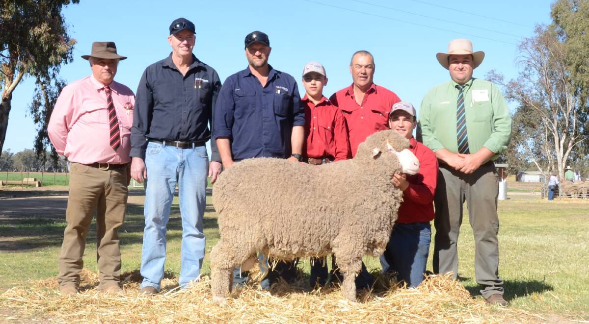 The $10,500 second top-priced ram with Scott Thrift, Elders, Dubbo, buyers Michael Wright and Phil Corker, D.F.D. Rhodes Pty Ltd, Boree Park, Dinninup, WA, Campbell, Glen and Mitchell Rubie, and Brad Wilson, Landmark, Dubbo.