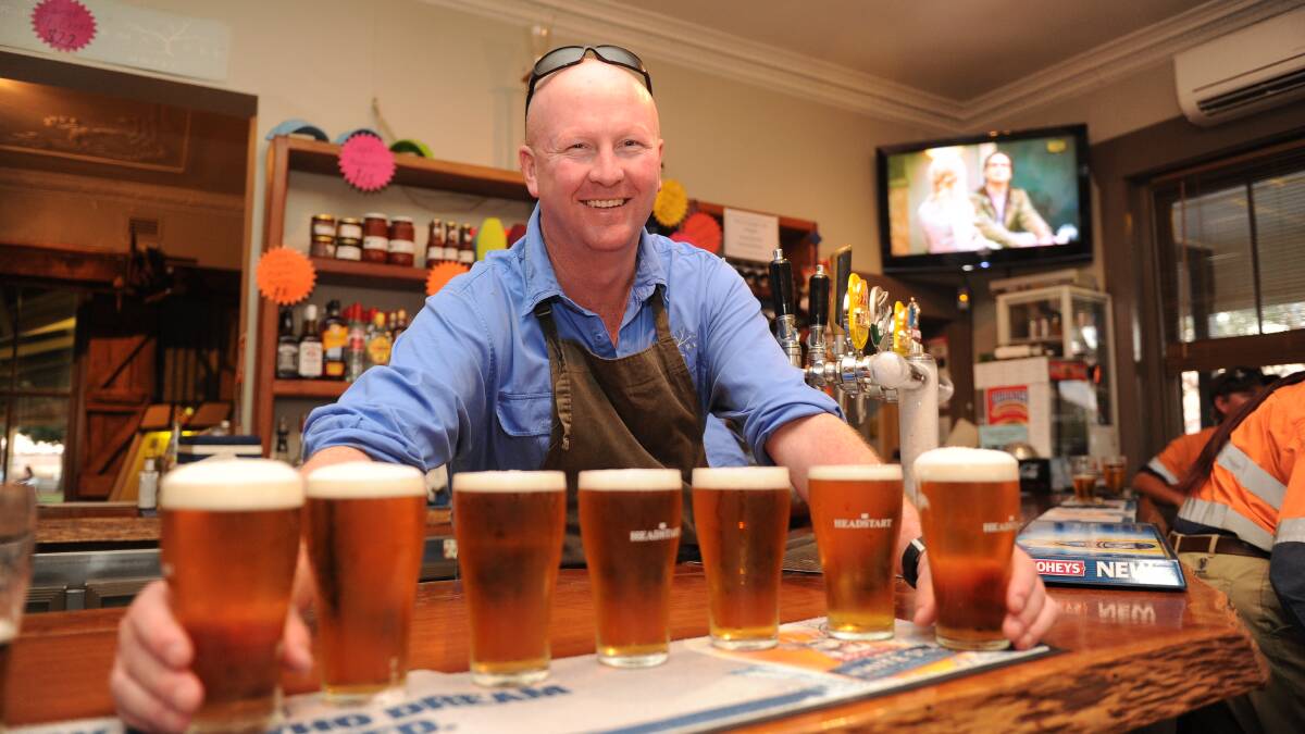 Armatree Hotel's Ash (lining up drinks) and Lib Walker, Armatree, between Gilgandra and Coonamble, celebrate their second successive Best Bush Pub award