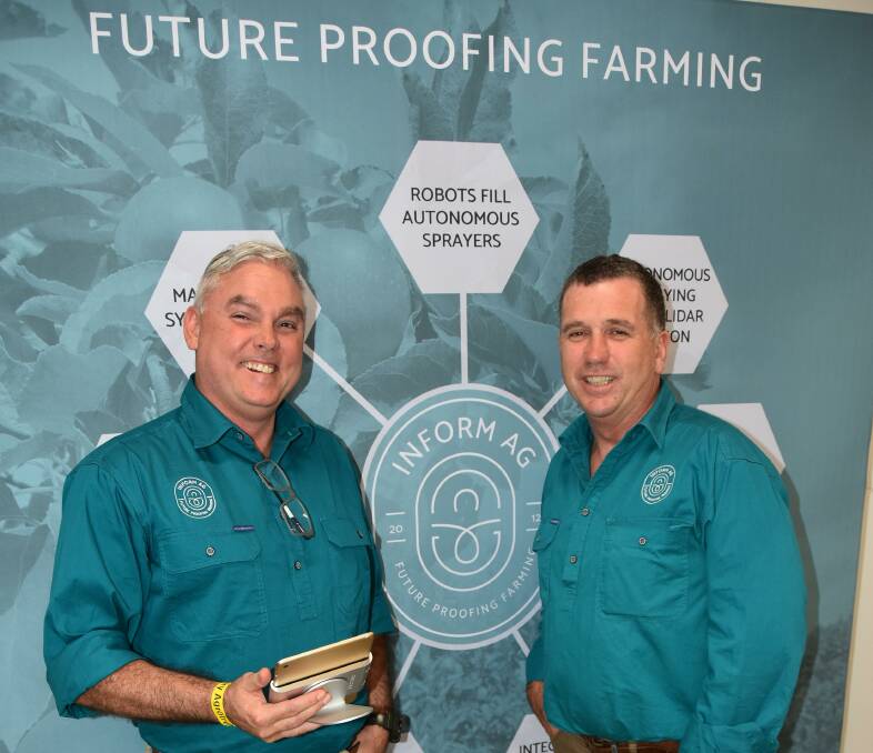 TRACKING: Alan Chambers and Terry Carty, Inform A.G check out the tablet-friendly version of the farming software platform which helps handle the various aspects to running a farming operation. 