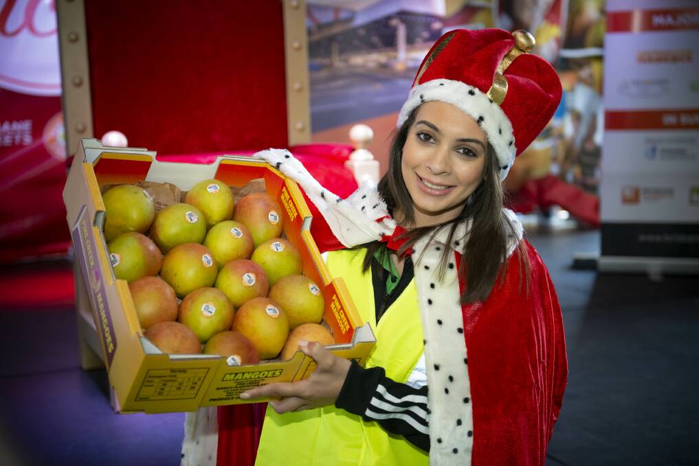 SOLD: The 2019 Mango Monarch, Alexandra Catalano, Nguyen's Farmers Market, with the first season tray of mangoes which she paid $25,000 for at the Brisbane Produce Market Annual Charity Mango Auction in September. 
