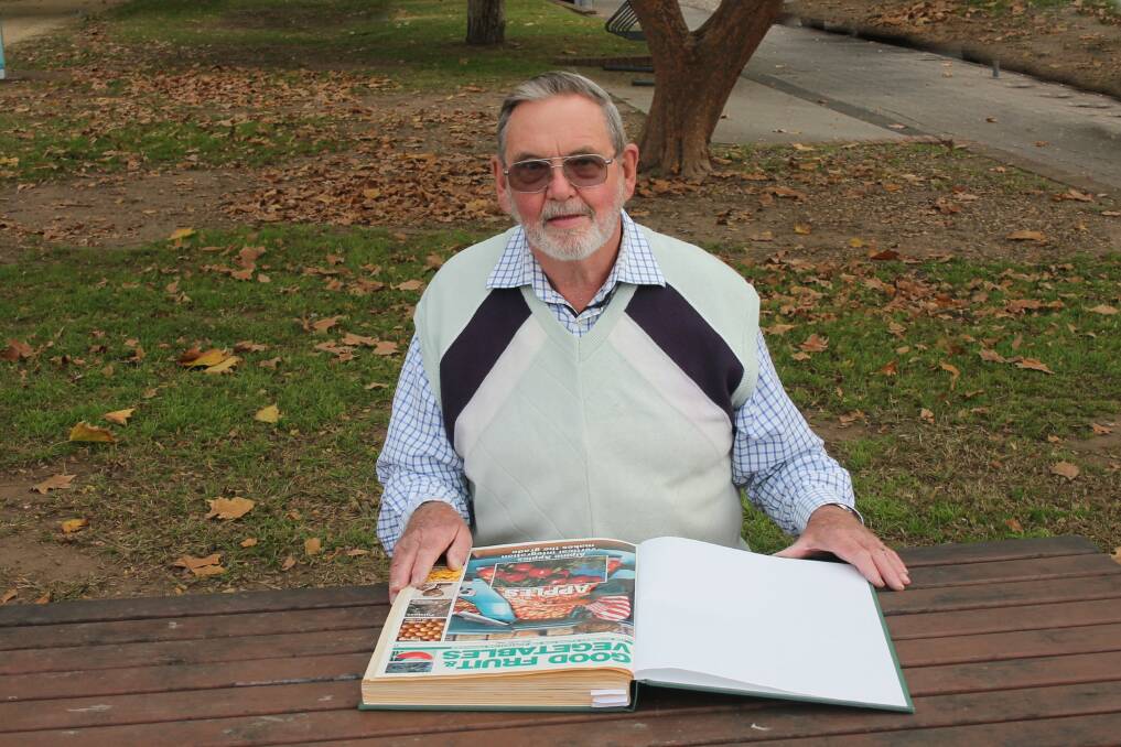 PIONEER: The late Tony Biggs, North Richmond, NSW was the inaugural editor of Good Fruit & Vegetables magazine. Here, he browses bound copies of the very first editions. Photo: Kelvin Tsui, Rabbit Photo Richmond NSW.