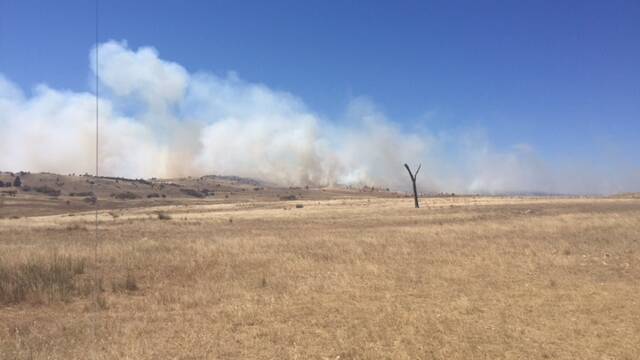 The Rural Fire Service is tackling a fire at Taylors Creek Road, near the Capital Wind Farm, southeast of Goulburn. Photo courtesy RFS.
