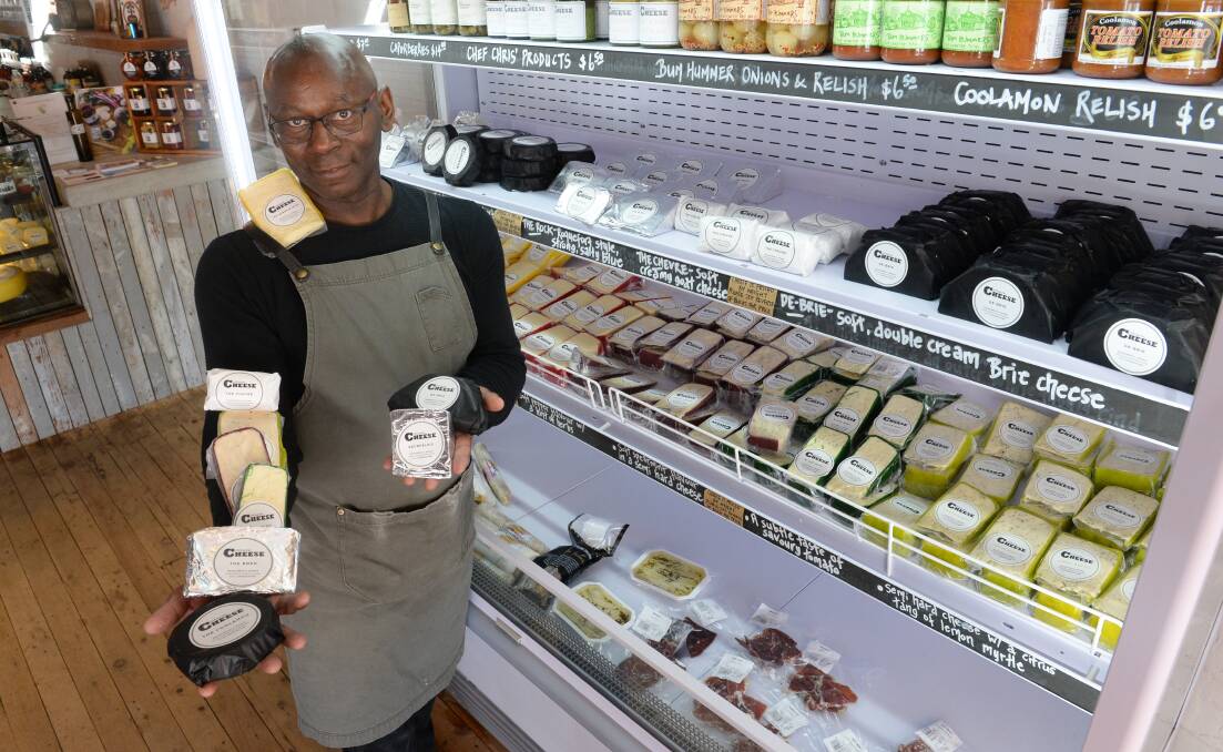 GREAT SELECTION: Coolamon Cheese waiter, Carlton Carter with a range of cheeses in the deli. Photo by Rachel Webb.