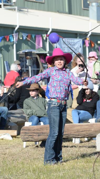 CRACKING: Jada Anderson, 11 cracking whips at the field days. Jada is a member of 'The Whipcracking Kids' with brothers Logan, 4, and Tyler, 13. Photo: Rachael Webb. 