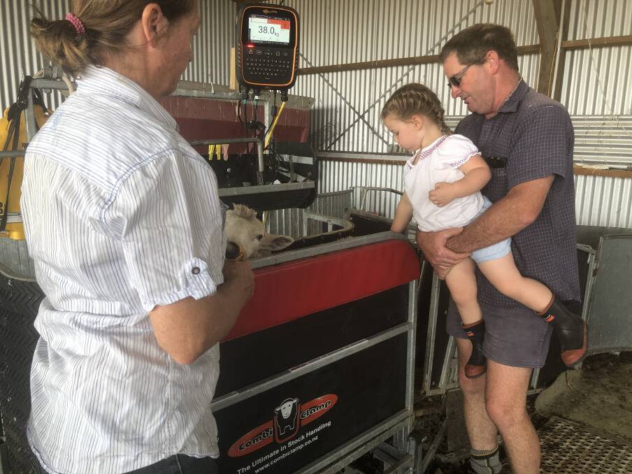 Lynley and Wayne Coffey show granddaughter Aria Quarrie how the Combi Clamp works.