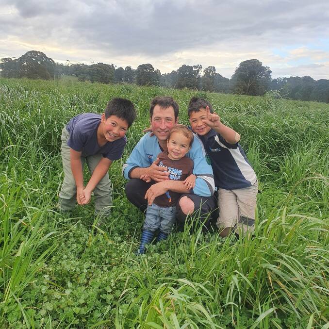FLOURISHING: Luke Winder and his sons Thomas (11), Jonathan (2) and Michael (6) enjoy the strong pasture growth at Tathra Place, Wombeyan Caves, NSW.