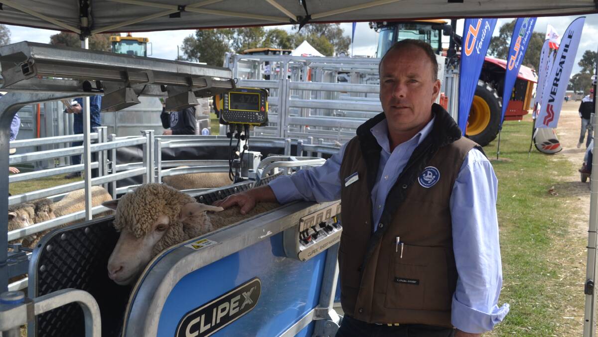 Clipex's Scott Franklin with their very popular sheep handler at the Henty Machinery Field Days. Clipex also featured part of their innovative fencing range.