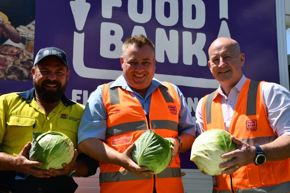 HELPING OUT: LLS farm manager Peter Conasch, and Foodbank NSW and ACTs Ben Cox and John Robinson with some of the produce donated.