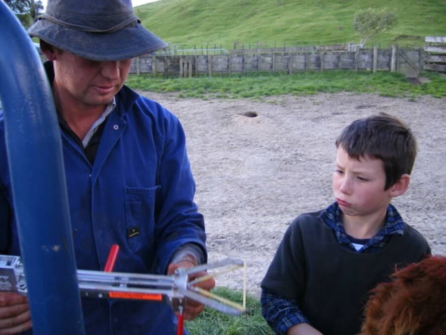 Farmer Tony Carr and son Toby checking out the Eze bloodless castrator tool.