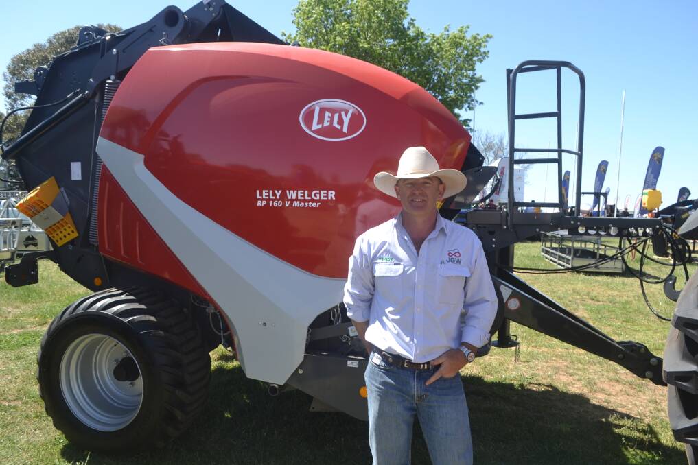JGW dealer principal Jeremy Whitty in front of a Lely baler on their site at the Australian National Field Days.