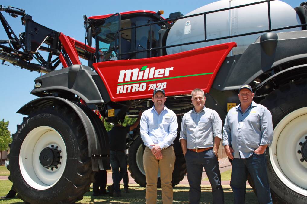 Tom Harvey, Temora Truck and Tractor, with Jonathan Bent, McIntosh Distribution, and David Thompson, AEH Group, inspect the new Miller Nitro 7420 sprayer.
