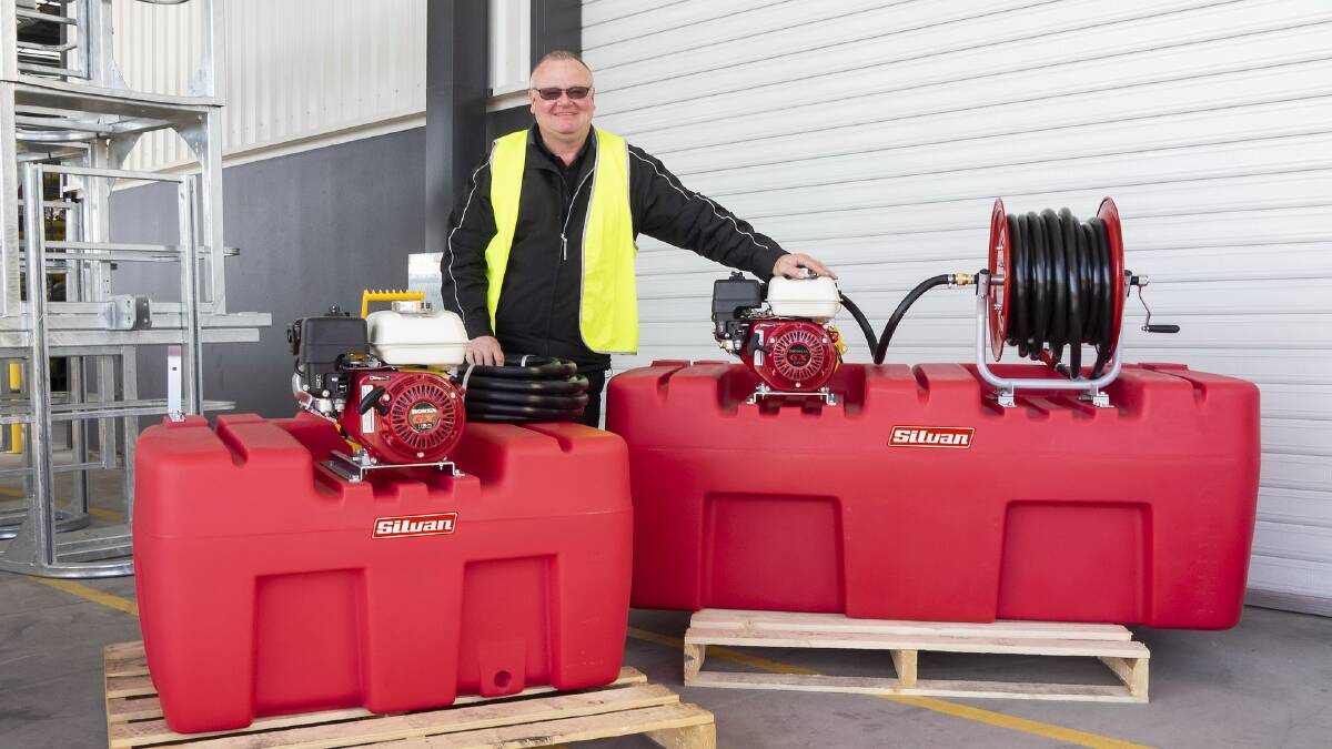 RECOMMENDED: Silvan Selecta warehouse manager Greg Everett with both the 400 and 800 litre Polytuff tank and engine, pump set.