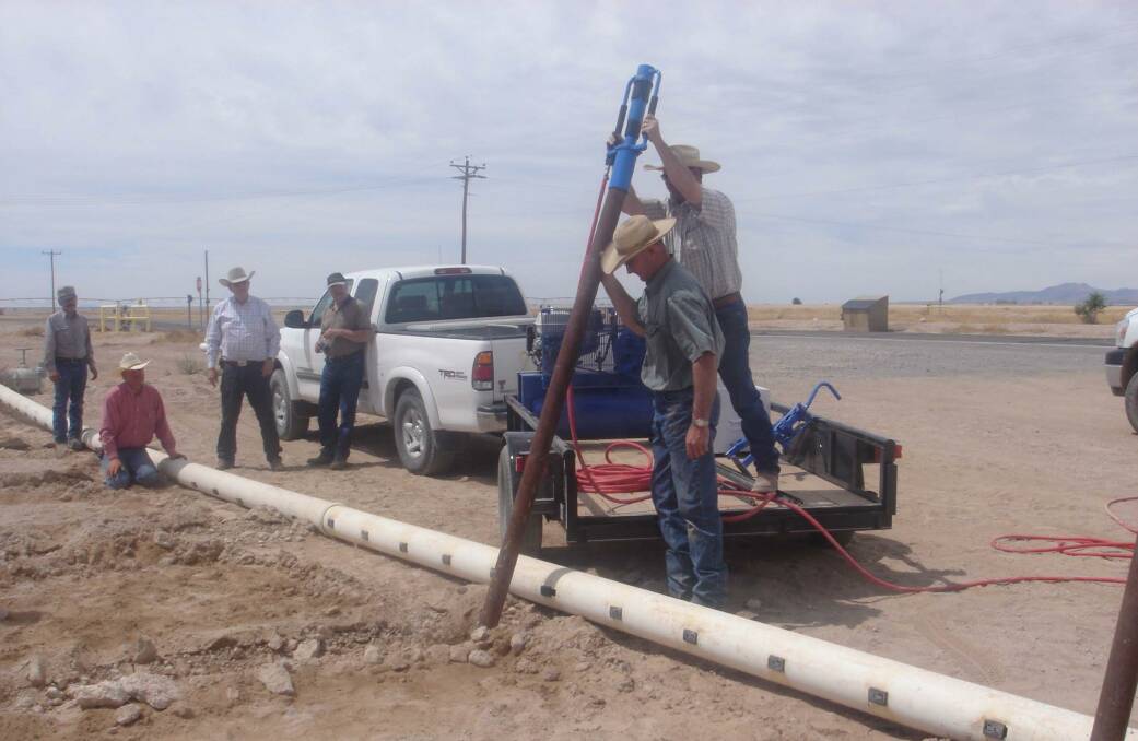 The Picket Post Driver driving pipe in Dell City, Texas, USA.