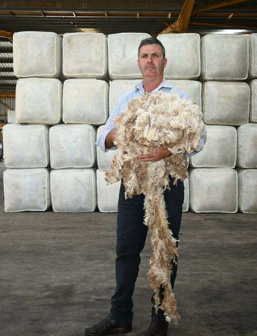 The shearer shortage is affecting all areas of the wool industry, including brokers like Jemalong Wool director, David Quirk. Picture by Denis Howard 