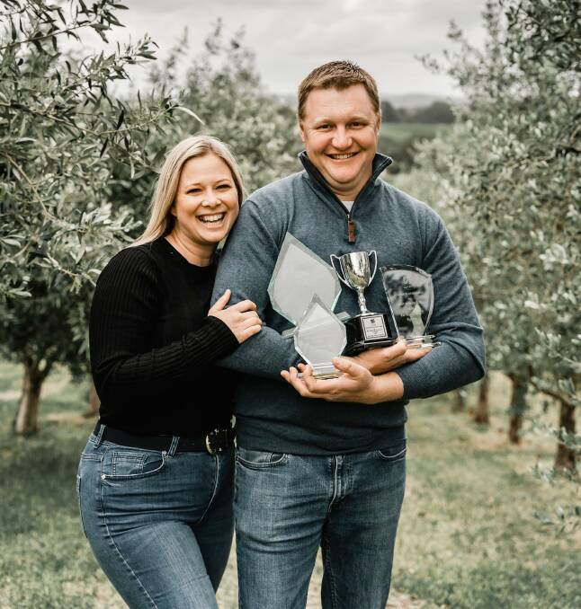 GRINNERS: Jared and Jacqueline Bettio enjoy their 2020 Australian International Olive Awards success in their Mount Torrens, SA, grove.