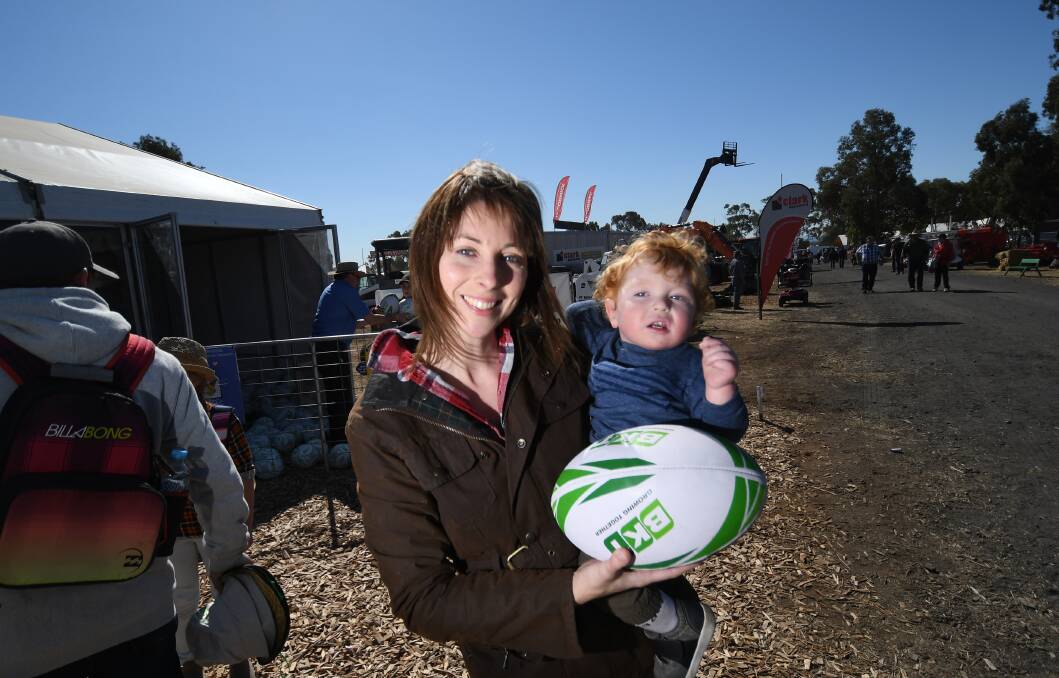 Future star: Boggabri's Lucy Barnes grabbed a rugby ball for her son Coen.