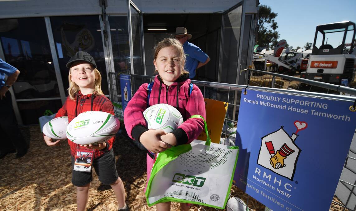Having a ball: Jack and Lilly Large get their hands on some fundraising footballs.    Photo: Gareth Gardner