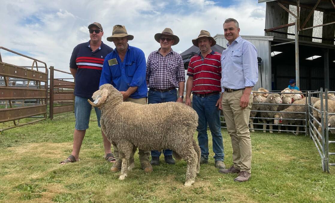 Marcus Lynam, Yarrawonga Pastoral Company, Biala, Dean, Neville and Ben McIntosh, Carrabungla, Laggan, and Mark Hedler, AWN, all pictured with the top-priced ram at the on-property sale. Picture supplied