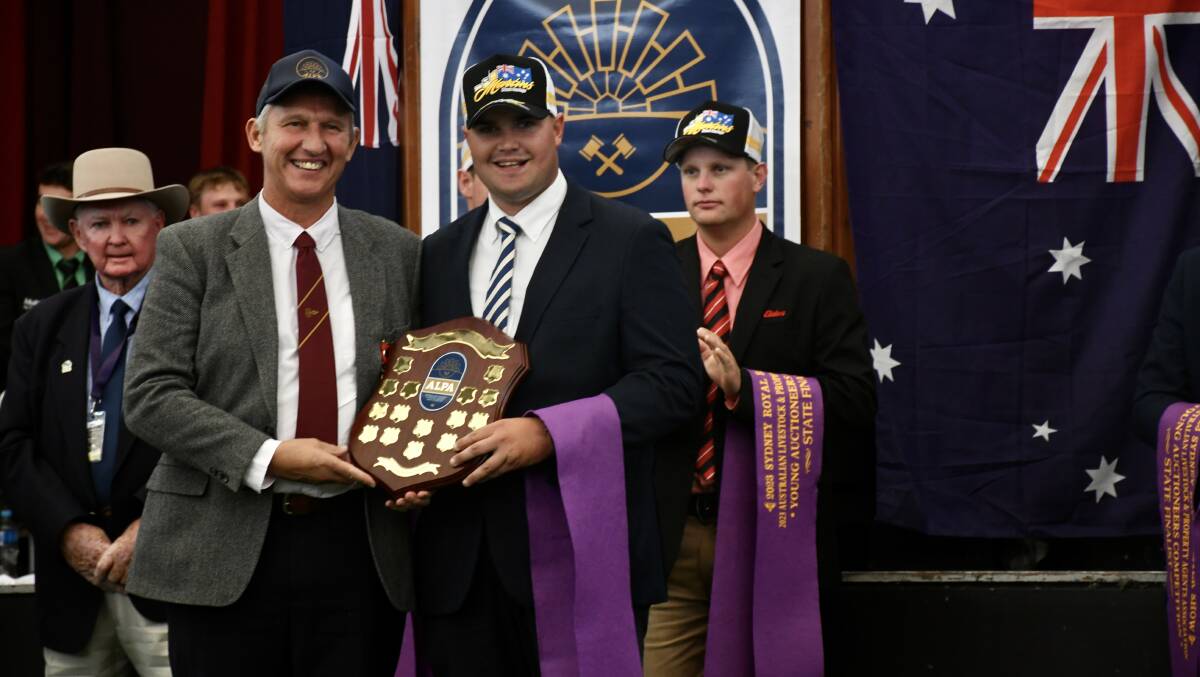 Richard Weekes presenting the John Weekes memorial trophy to the 2023 ALPA NSW Young Auctioneers Competition winner Michael Purtle. Picture by Clare Adcock