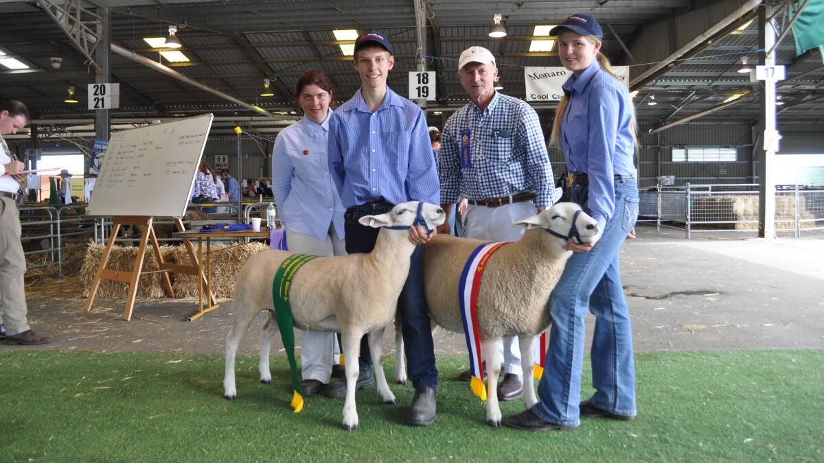 Texel judges Peter Matus and Elizabeth Graham, with the Champion and Reserve Champion Texel ewes from the Monkitee Stud and their handlers, Morrison De Monk and Blake Wynn, Braidwood Central School. 
