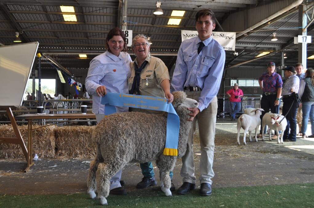 Judge Elizabeth Graham, Ardachy stud, New Zealand, with Bronwyn Jekyll, Drap'hyd Merino Stud, Yass River, and Sam Maxwell, St Gregory's College, with the surpreme all breeds school sheep exhibit, a one year old Corriedale ewe lamb. 