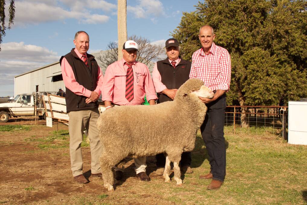 Paul Jameson, Kevin Webber and Scott Thrift of Elders stud stock, Dubbo, with stud principal Garry Kopp and the top priced ram which sold for $12,000 at last Friday's sale.