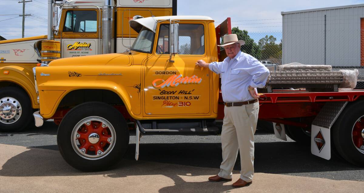 TWO LEGENDS: Gordon Martin with his first truck, an International AA 180, which he bought in 1958 to cart calves and pigs from Singleton and Maitland to Sydney's Homesbush abattoir via the then notorious Putty Road. 